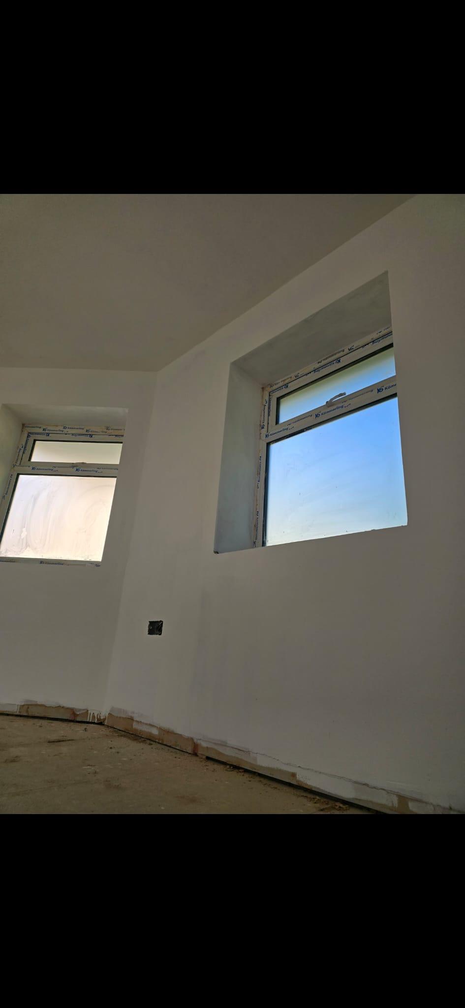 Smooth plaster around windows