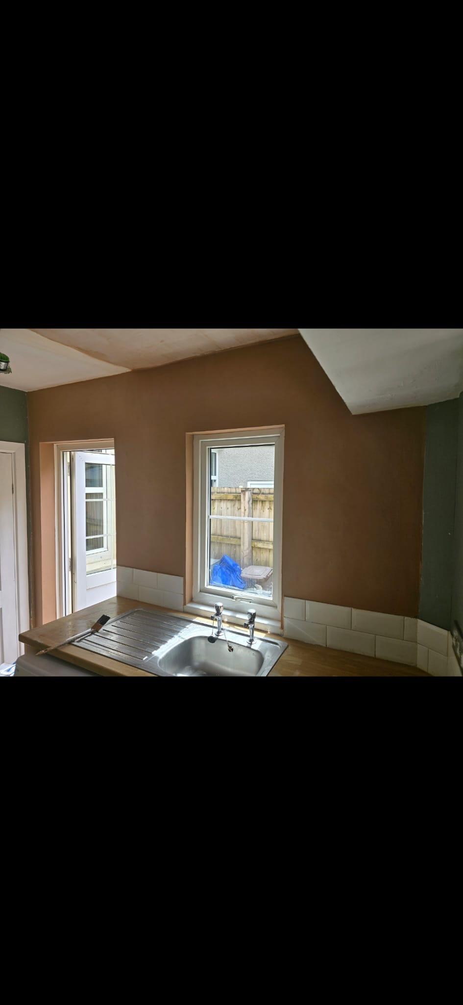 Freshly plastered kitchen wall