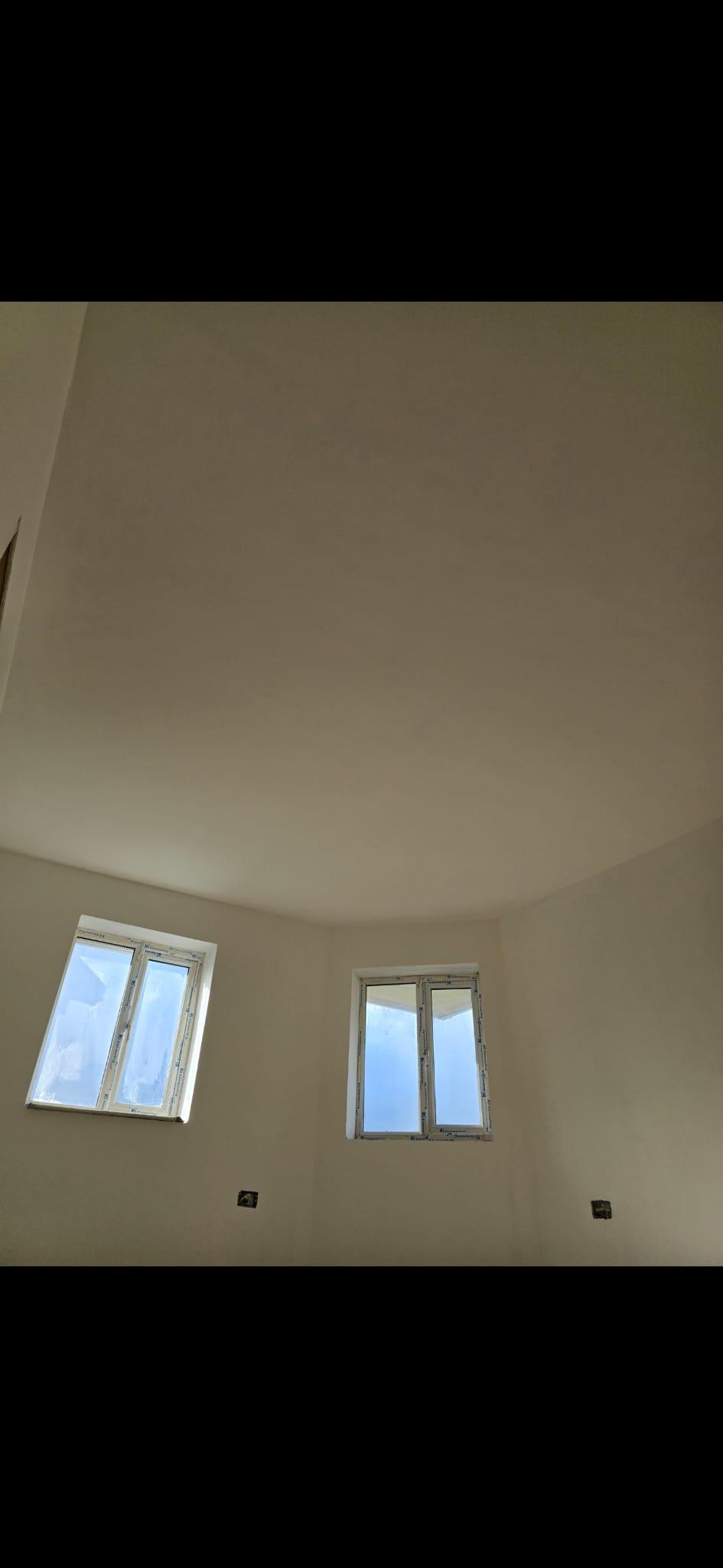 Smooth plaster finish on walls and ceiling